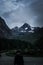 Man is looking on a great view of a mountain Grossglockner . Lo