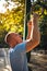 Man looking at gymnastics rings in the park