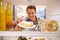 Man Looking Inside Fridge Full Of Unhealthy Foodï¿½