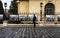 Man looking at the names of the heroes murdered at the 1989 Romanian Revolution on the fence of National Art Museum in Bucharest,