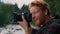 Man looking pictures on photo camera. Tourist making photos on digital camera