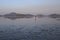 A man Looking for Shellfish at Low Tide in  Sunset time, Wading in Water