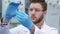 Man looking at the test-tube at the laboratory