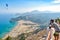 Man is looking at Tsampika bay from balcony on Rhodes island, Greece