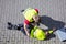 Man Looking At Unconscious Person Lying On Cobblestone Street