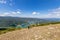 Man looking a valley with lake during trekking on mountain. Hiking italian mountain, local tourism and natural landscape. Eco