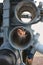 A man looks through the tube of an anti-submarine and anti-torpedo rocket launcher RBU-6000 Smerch-2. Closeup