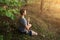 Man in lotus pose meditation, prayer , yoga, outdoors in nature