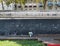 Man lounges and child draws at public chalk board, Paris