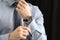 Man with luxury wrist watch on dark background, closeup