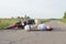 The man is lying on the asphalt near the motorcycle, the theme of road accidents