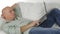 Man Lying on the Couch Use Laptop Wireless Communication