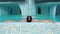 The man is lying relaxes in the swimming pool. Caucasian man resting in the jacuzzi. Back view