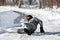 Man lying on the road, downfall and accident on winter season, black ice