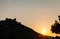 Man lying on the rock enjoying sunset