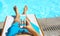 Man lying on sunbed near pool with phone. Summer vacation