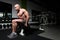 Man On Machine Exercising Quadriceps And Glutes