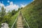 Man-made staircase upstairs to the hill with green grass, travel and tourism concept