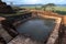 The man made water tank chisled out of solid rock which sits at the summit of Sigiriya Rock Fortress in Sri Lanka.