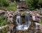 Man made waterfalls over rocks in the Betty Ford Alpine Gardens in Vail, Colorado.