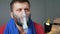 Man makes inhalation using nebuliser. Slow motion and close-up