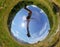 Man makes a jump in a mountain meadow. View from below. Daylight