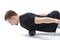 A man makes strengthening exercises for the body with special sports equipment. Self massage increases the body`s tone