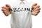 Man makes a welcome gesture with welcome word