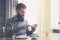 man making breakfast with cup of coffee and toasts