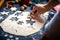 Man making a festive decorated pastry with a mold