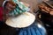 Man making an ulta tawa paratha bread on an upturned pot mughal cuisine from india and pakistan