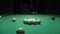 A man a man breaks a pyramid of white billiard balls. Start playing Russian billiards