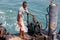 Man manages the ship in port of Nosy Be, Madagascar