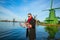 Man with a map walks  in Zaanse Schans