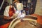 The man in the mask brews beautiful welds with argon-arc welding