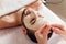 Man in the mask cosmetic procedure in spa salon