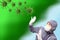 Man with mask and gloves is attacked by a green cloud and spherical virus