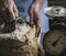 Man measuring the flour by the weighting scale