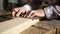 Man measuring wooden board with ruler