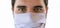 Man in a medical mask close up portrait. Healthcare. Covid-19 coronavirus symptoms.