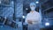 Man in medical mask with papers stands near metal tank