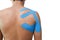 Man with medical taping on the shoulder