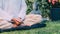 Man meditating Outdoors and keeping hands together in a prayer position