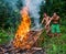 Man Mentawai tribe prepares on a fire killed a wild pig hunting