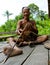 Man Mentawai tribe prepares poison for the arrows for hunting.