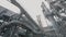 A man at a metallurgical plant. A worker walks through a large factory. Massive metal structures at a metallurgical