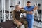 Man in military clothing is having consultation with rehabilitation specialist