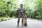 Man in military uniform with German shepherd dog