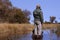 Man in a mokoro canoe in the Okavango Delta, Botswana