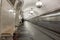 Man in Moscow metro station with trains slow shutter speed